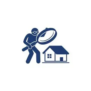 A man is looking through a magnifying glass at a house.