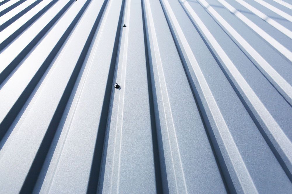 Close-Up of a Grey Metal Sheet Part of A Roof — Roofer in Orange, NSW