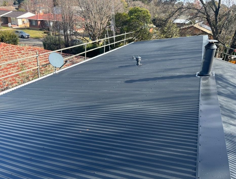 Worker Tiling a Roof — Roofer in Orange, NSW