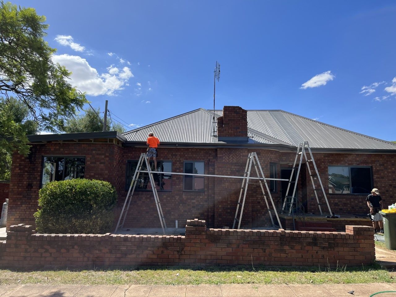 Workers Installing Metal Roofing — Roofer in Orange, NSW