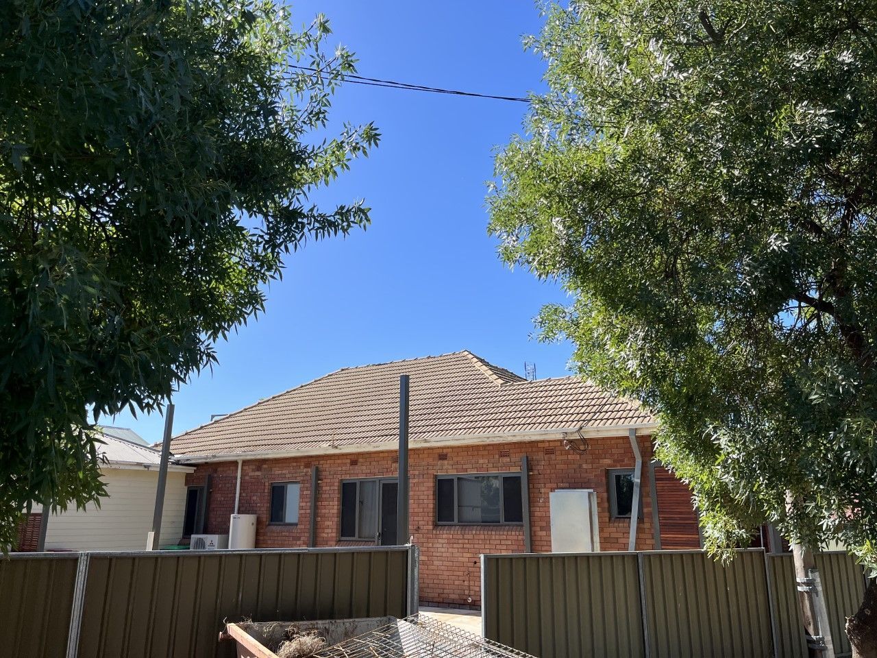 Worker on Roof at Works with Flex Tile — Roofer in Parkes, NSW