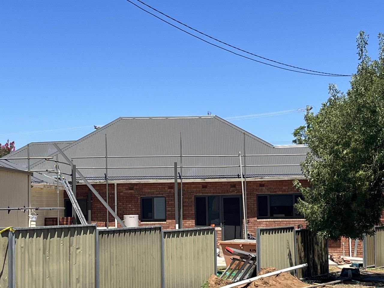 Scaffolding around new roof — Roofer in Orange, NSW