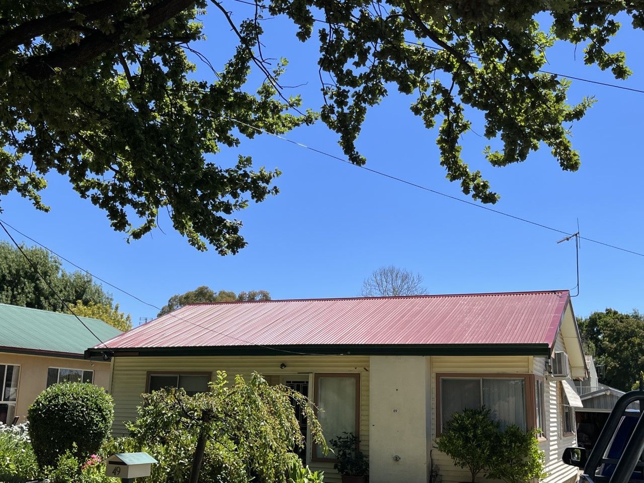 Worker Installing House Roof Rain Gutter System — Roofer in Orange, NSW