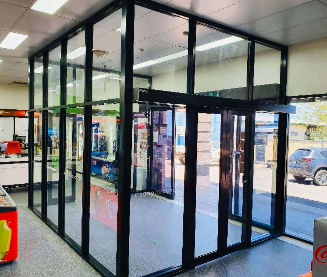 a Store With a Lot of Glass Doors and Windows — Accessories in Cassowary Coast, QLD