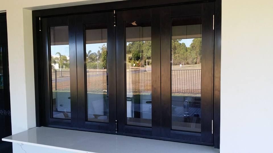 a Window With a Reflection of a Fence in It — Accessories in Cassowary Coast, QLD