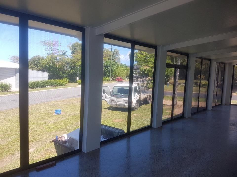 a Large Room With a Lot of Windows and a Truck Parked in the Grass — Accessories in Cassowary Coast, QLD