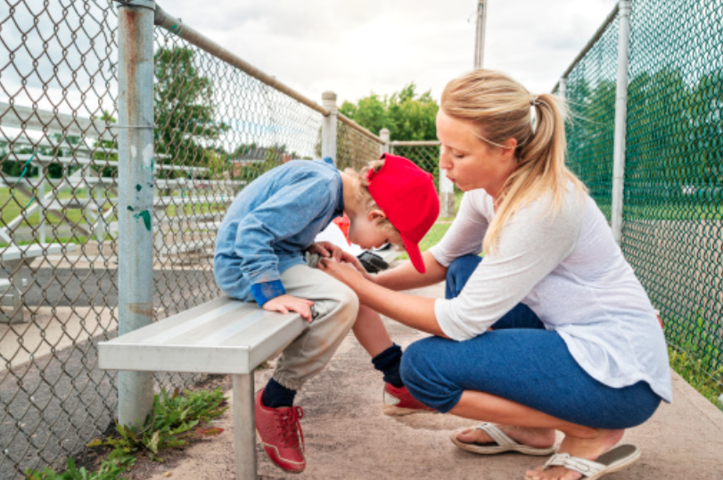 woman attending to an injured child