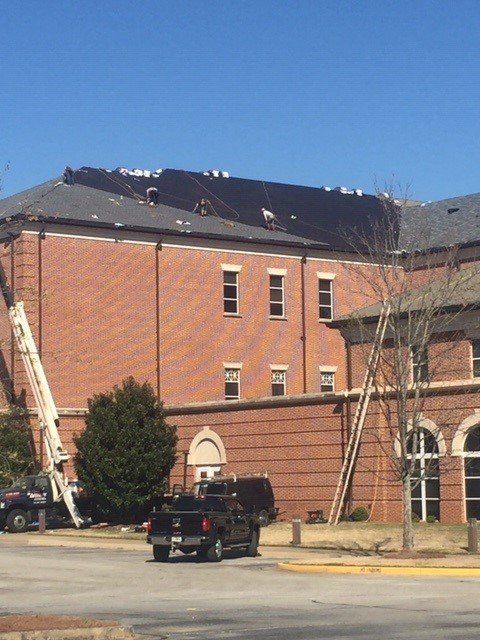Roof repairing on large building — Atlanta, GA — Atlantic Restoration Services