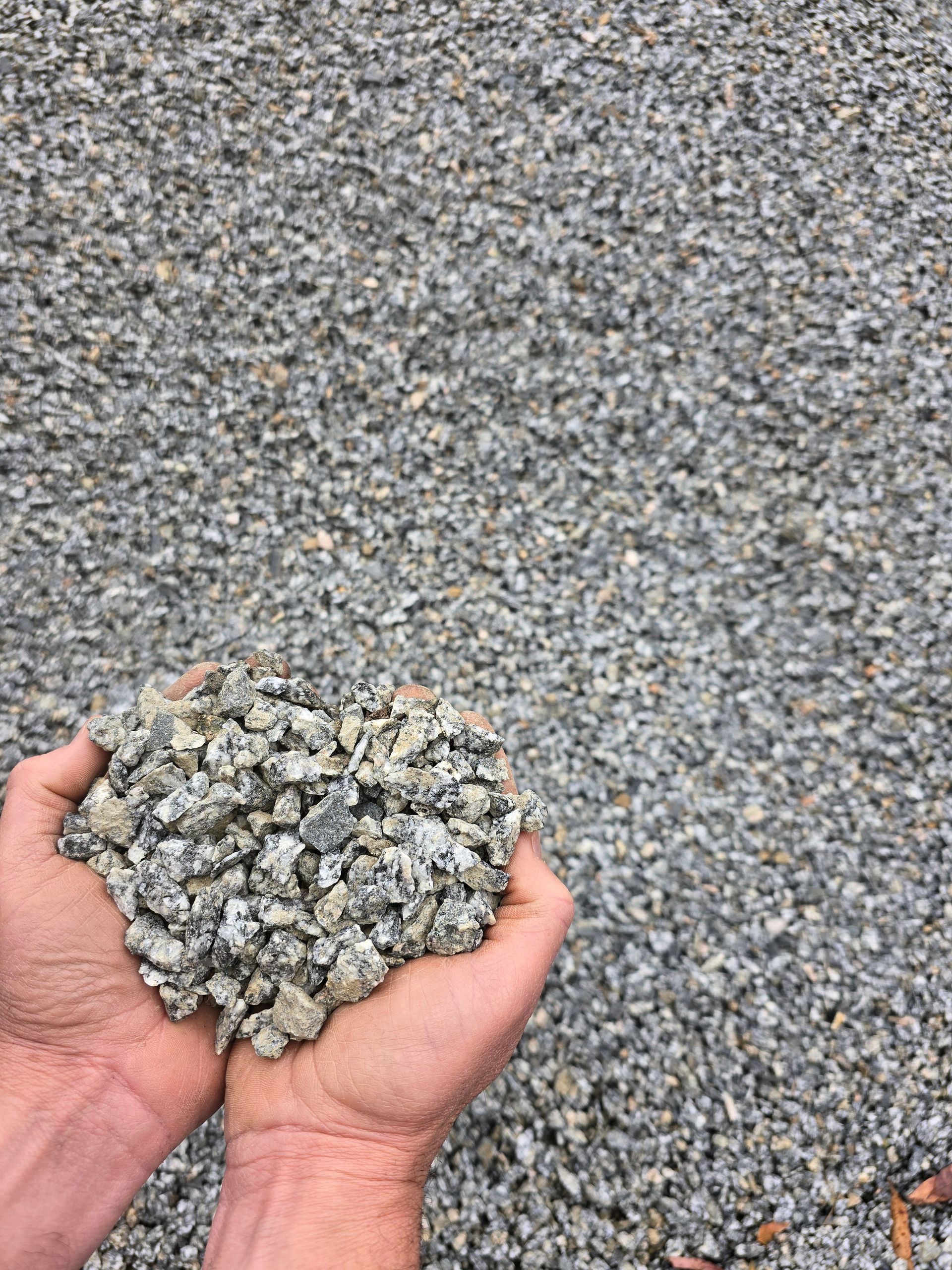 Hands Cupped, Holding a Pile of Small, Gray Gravel — BVN Landscape & Steel Supplies in St Georges Basin, NSW