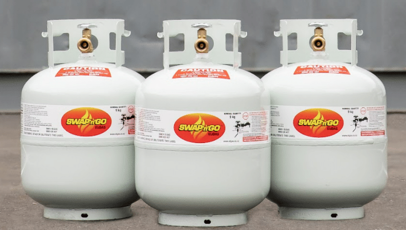 Three White Propane Tanks With Red and Yellow Logos — BVN Landscape & Steel Supplies in St Georges Basin, NSW