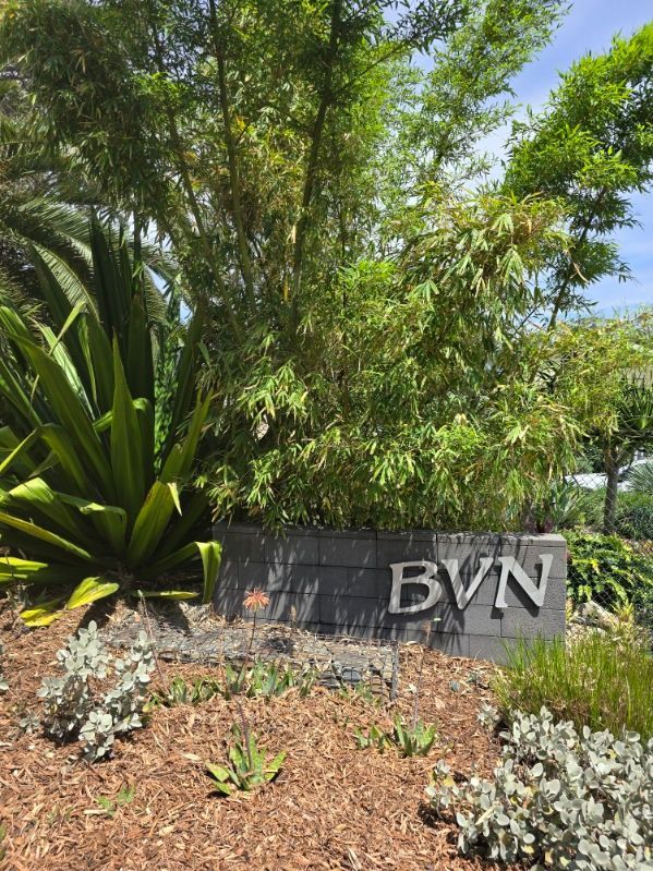 Sign for BVN Under Green Trees, With Plants and Mulch — BVN Landscape & Steel Supplies in St Georges Basin, NSW
