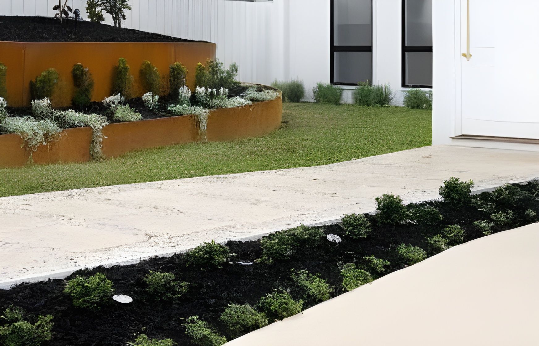 A modern walkway features a rusted metal planter bed on the left and a landscaped garden edge against a white home. — BVN Landscape & Steel Supplies in St Georges Basin, NSW