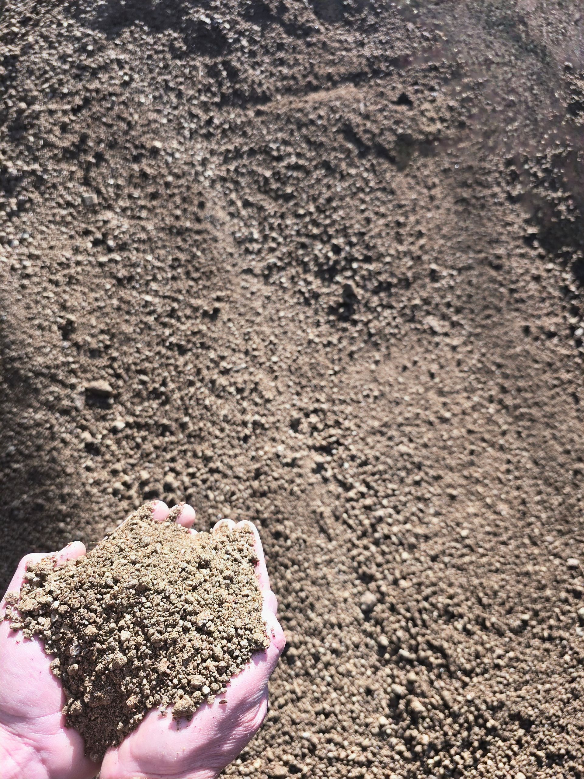 Handful of Tan-colored Soil — BVN Landscape & Steel Supplies in St Georges Basin, NSW