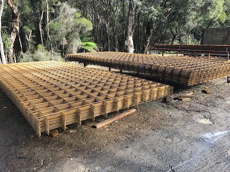 A Bunch of Metal Sheets Are Sitting on Top of Each Other on The Ground — BVN Landscape & Steel Supplies in Vincentia, NSW