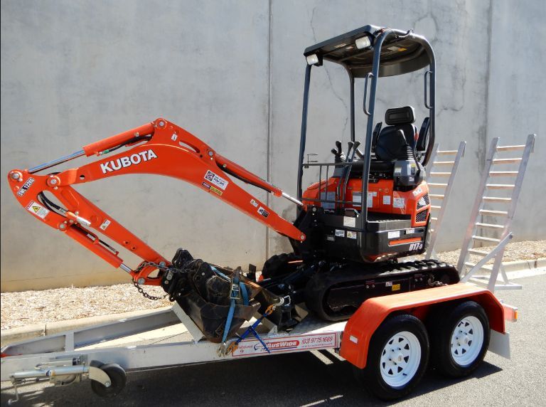 Orange Kubota Mini Excavator on a Trailer, Ready for Transport — BVN Landscape & Steel Supplies in St Georges Basin, NSW
