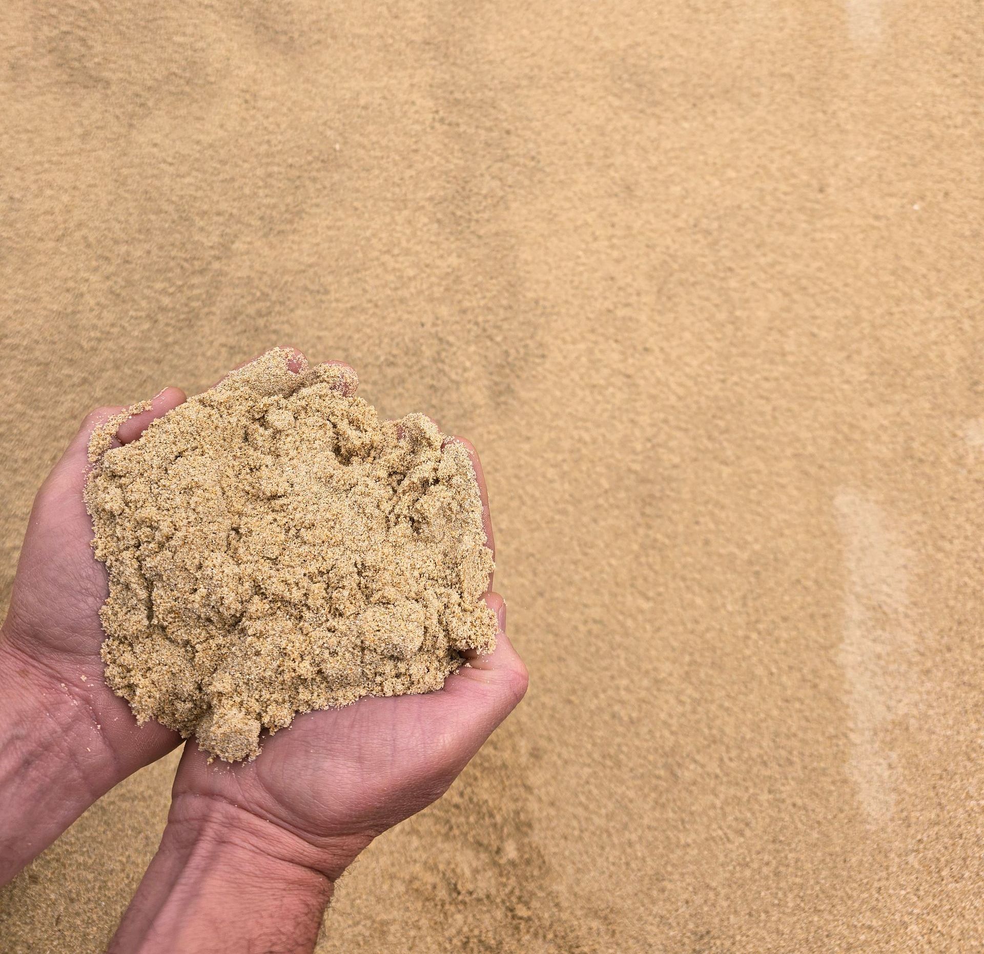 A Pile Of Sand In Someone's Hands — BVN Landscape & Steel Supplies in St Georges Basin, NSW