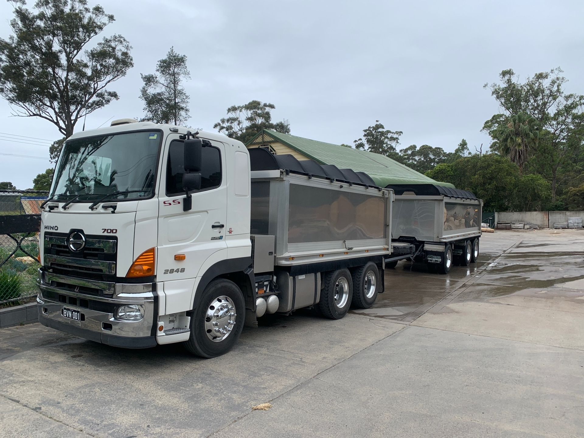 White Dump Truck With Trailer, Parked on Pavement — BVN Landscape & Steel Supplies in St Georges Basin, NSW