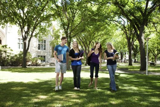 Students walking through campus visiting