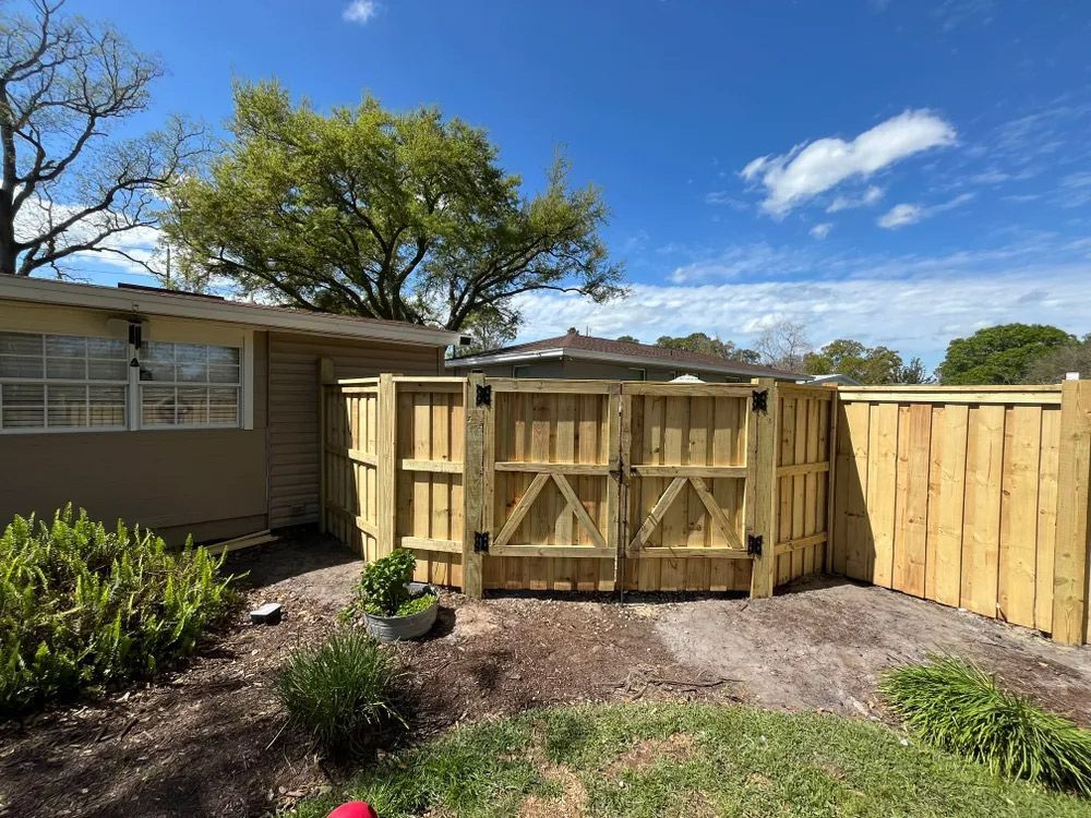 Wooden fence with double gates