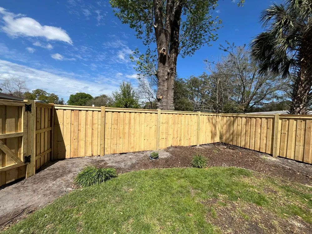 A new wooden fence in a backyard