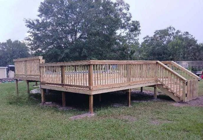 Light-wood deck with railings and steps