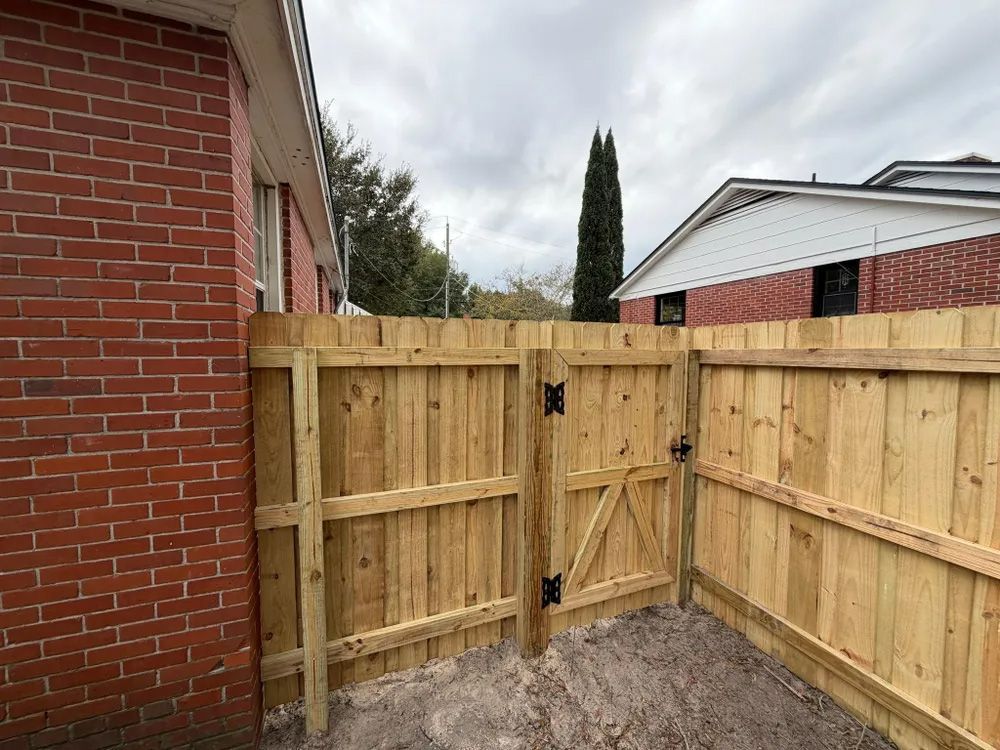 Constructed wooden fence with a gate