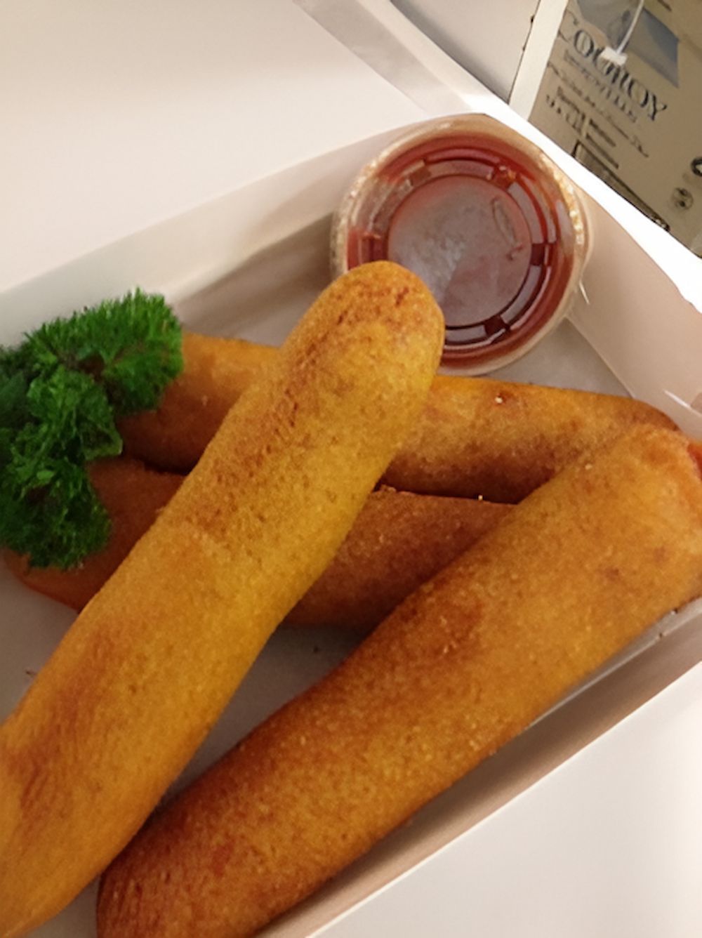 A Box Of Corn Dogs With Parsley And Dipping Sauce — Noosaville Fish Market In Tewantin, QLD