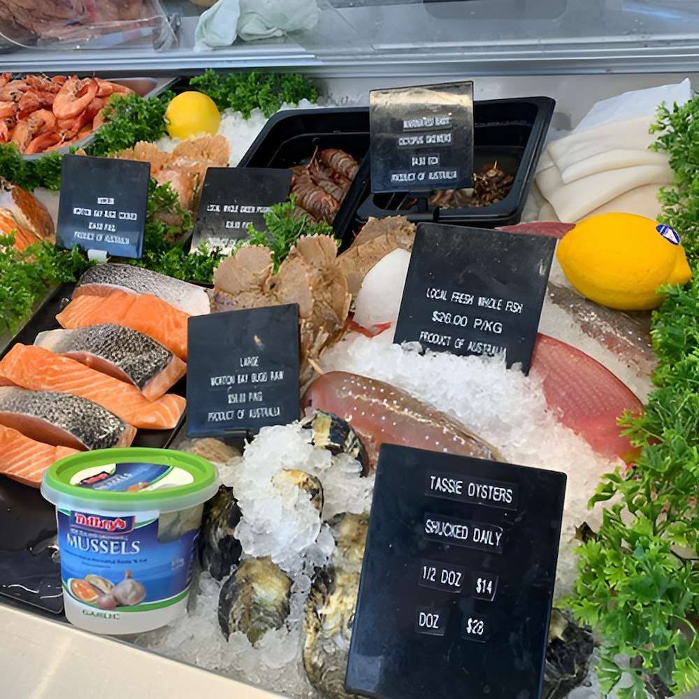 A Display Case Filled With A Variety Of Seafood Including Oysters — Noosaville Fish Market In Tewantin, QLD
