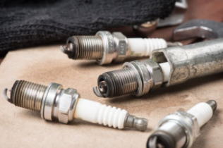 Used spark plugs being replaced by a mobile mechanic in Cheyenne, WY