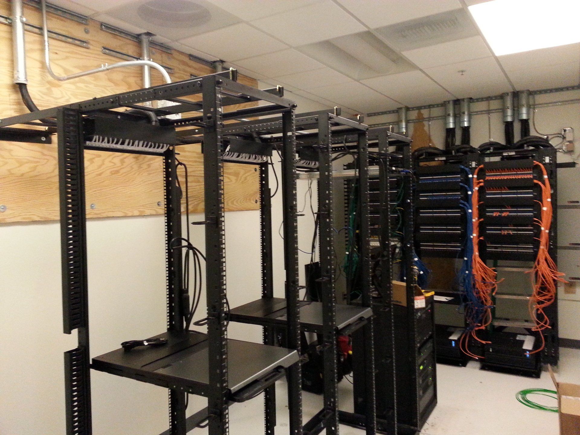 A room with a lot of shelves and servers