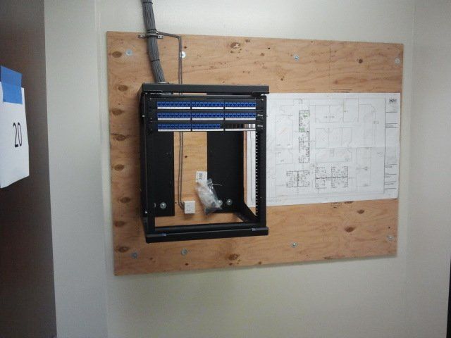 A drawing of a building is hanging on a wall