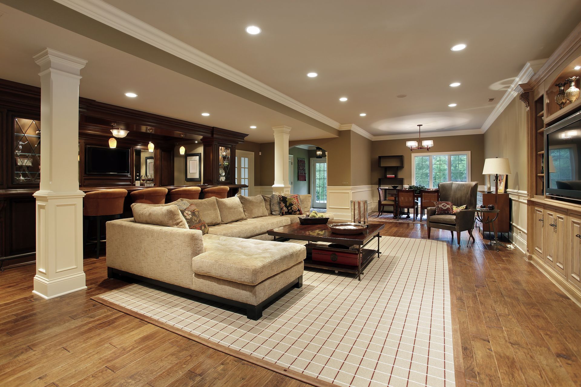 A living room with a couch and a rug