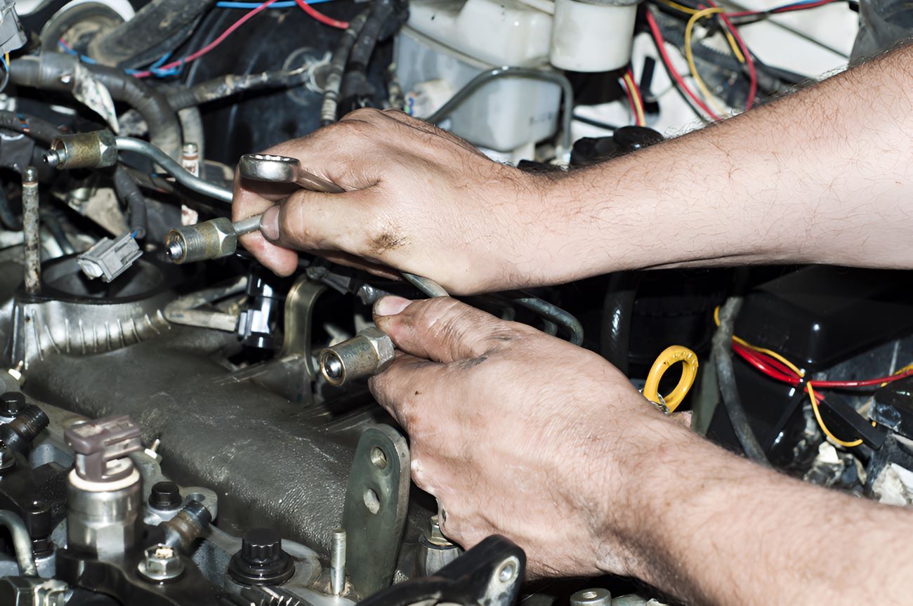 A Man is Working on a Car Engine — SMK Rural & Mechanical Pty Ltd in Rockhampton City, QLD