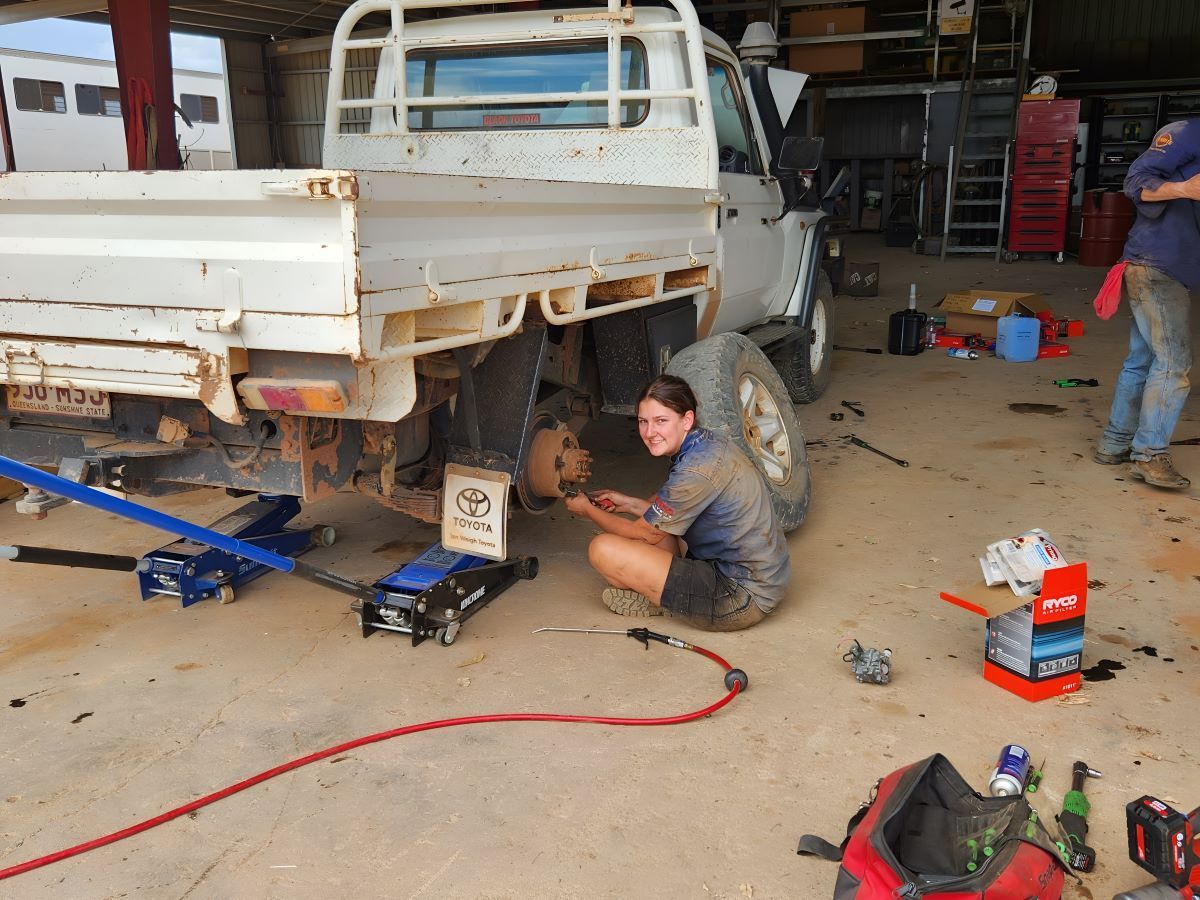 A Woman is Working on a Truck in a Garage — SMK Rural & Mechanical Pty Ltd in Rockhampton City, QLD