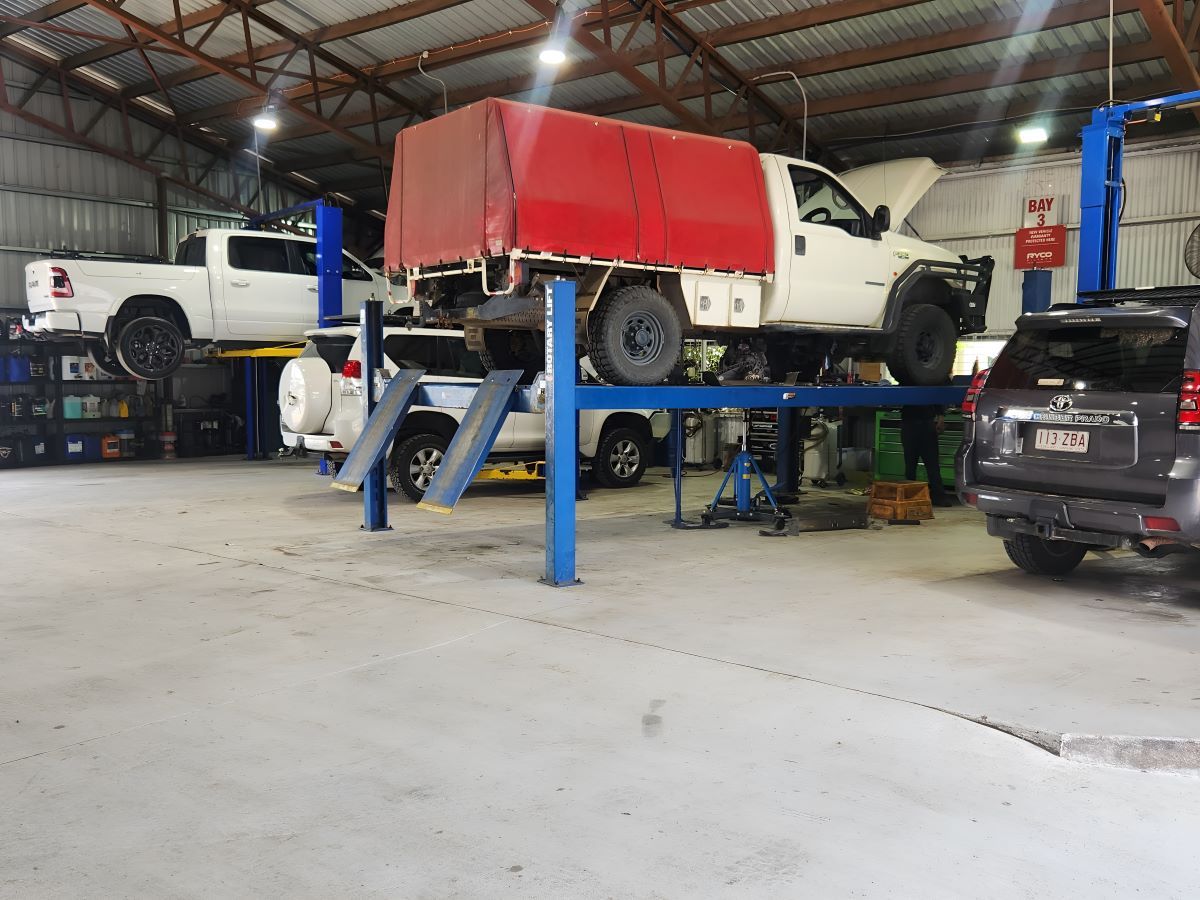 A Truck is Sitting on a Lift in a Garage — SMK Rural & Mechanical Pty Ltd in Rockhampton City, QLD
