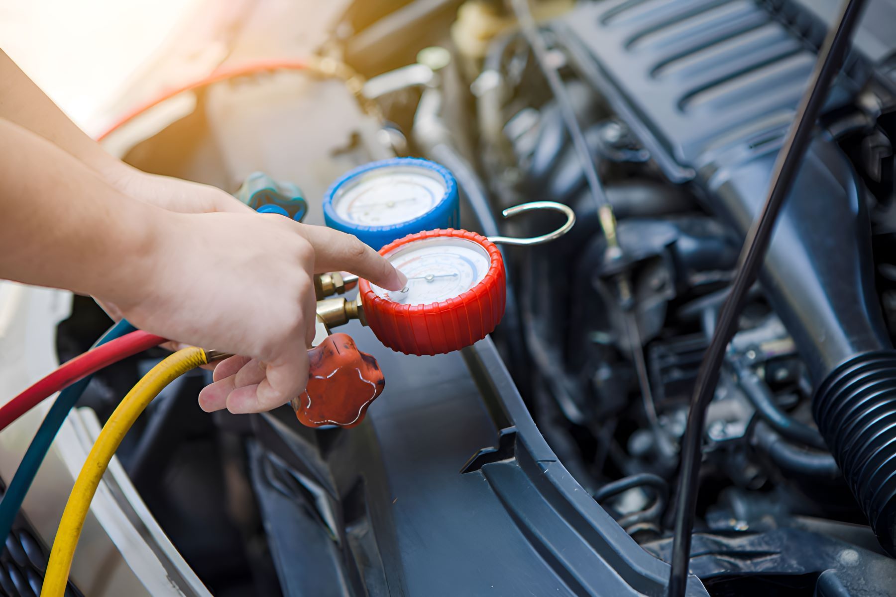 A Person is Working on the Air Conditioning System — SMK Rural & Mechanical Pty Ltd in Rockhampton City, QLD