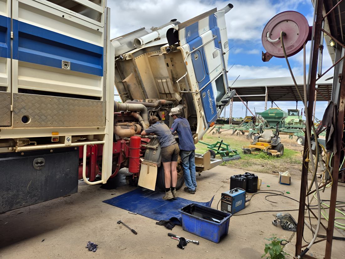 A Group of People Are Working on a Truck — SMK Rural & Mechanical Pty Ltd in Rockhampton City, QLD