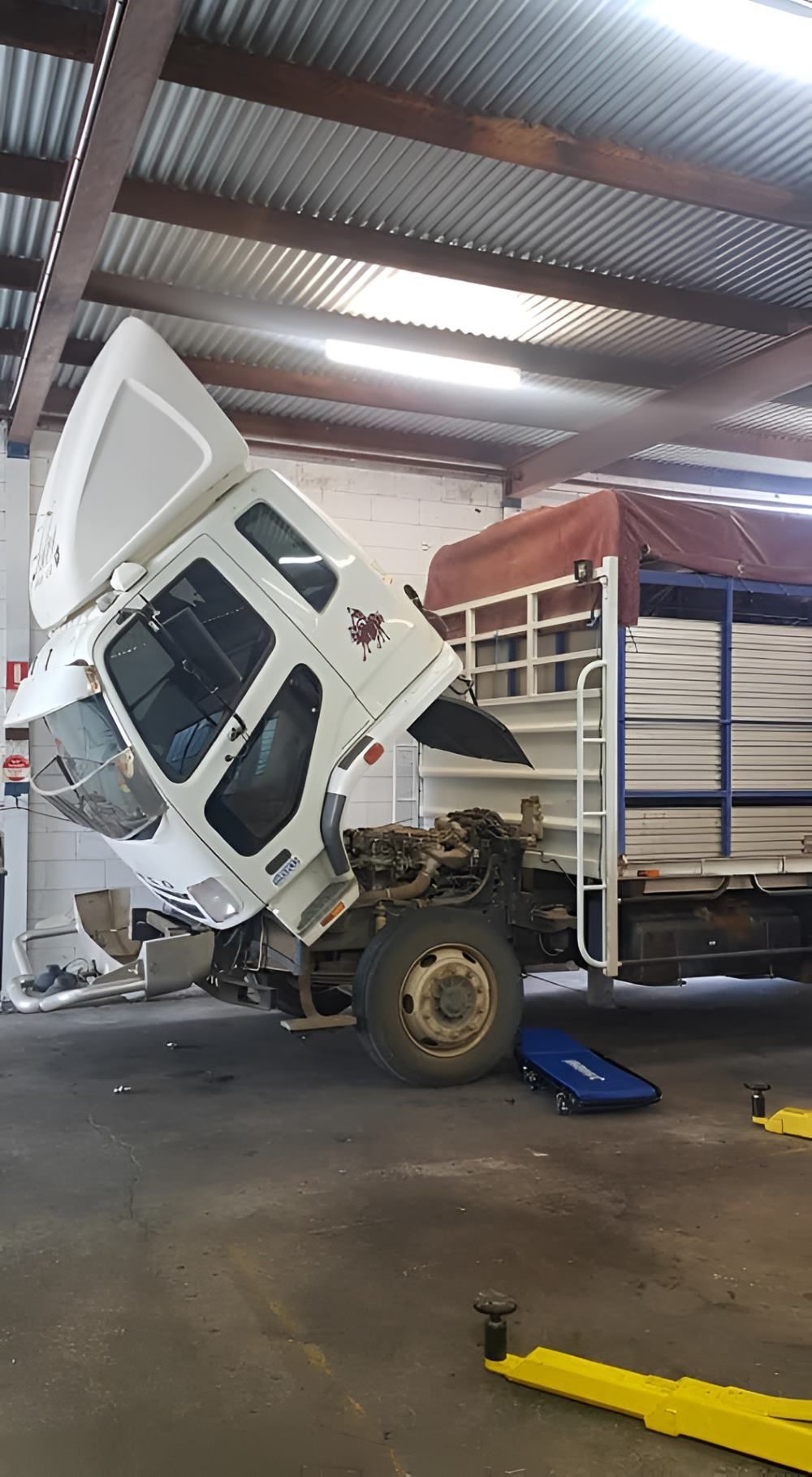 A Truck is Being Repaired in a Garage — SMK Rural & Mechanical Pty Ltd in Rockhampton City, QLD