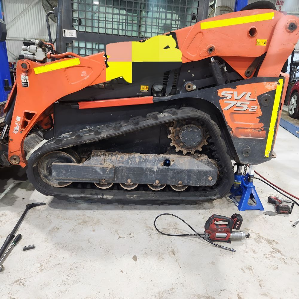 A Tractor is Repaired in Garage — SMK Rural & Mechanical Pty Ltd in Rockhampton City, QLD