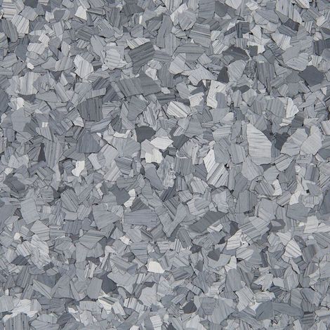 Gray speckled textured surface with small irregular chips arranged densely across the frame