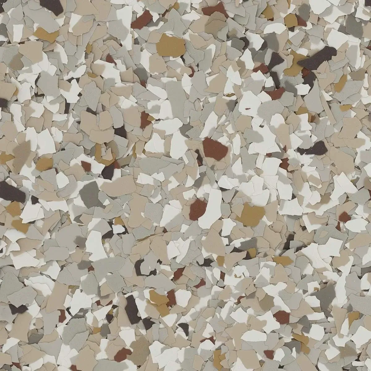 Close-up of a beige, tan, and gray speckled stone or terrazzo surface.
