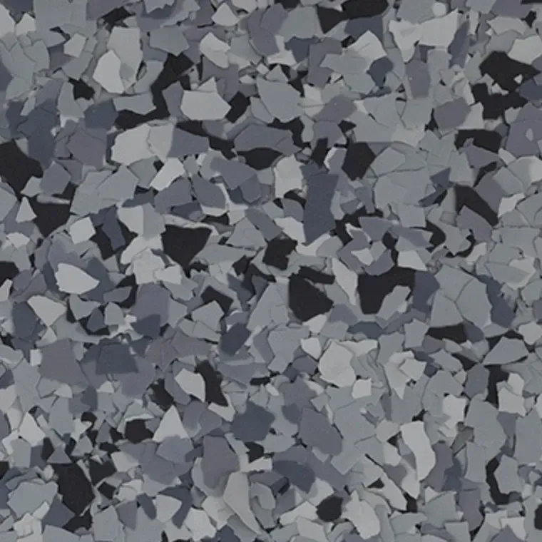 Gray and black camouflage-like abstract pattern of scattered stone fragments