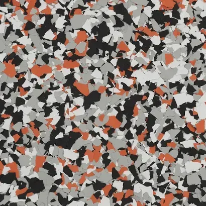 Abstract confetti-like pattern in black, gray, white, and orange-red scattered shapes