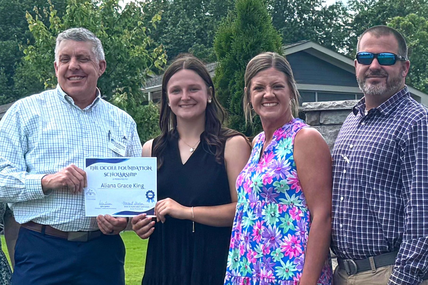 Mason Bridges Scholarship winner with Celina Team