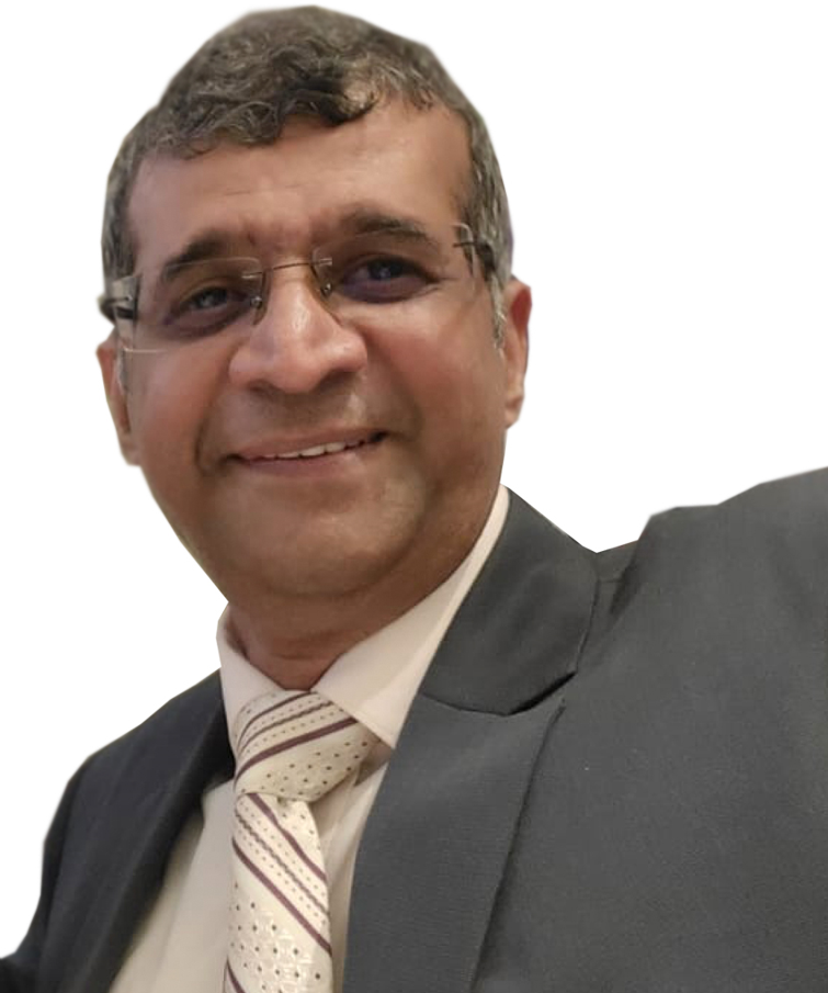 A man in a suit and tie is smiling for the camera