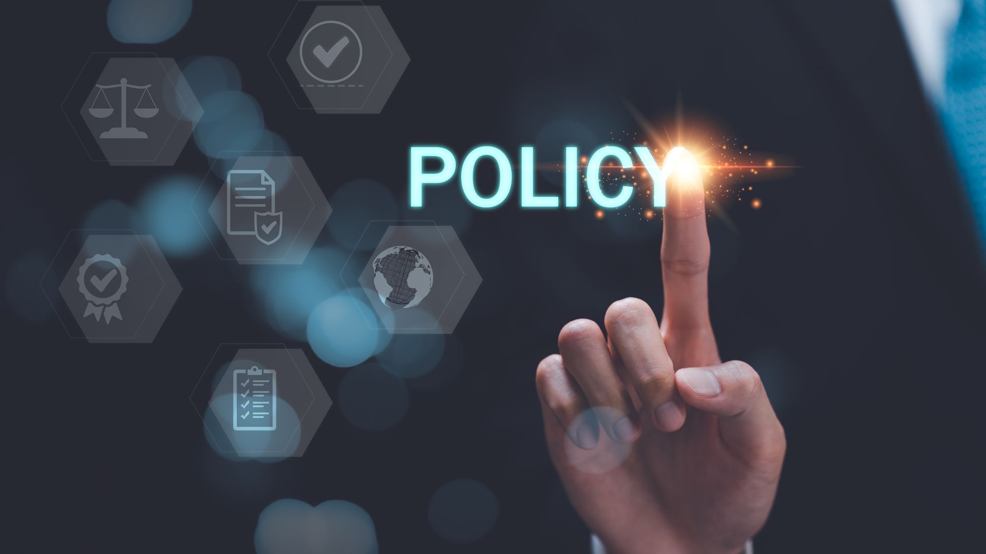 A hand is pointing at the word policy on a screen.