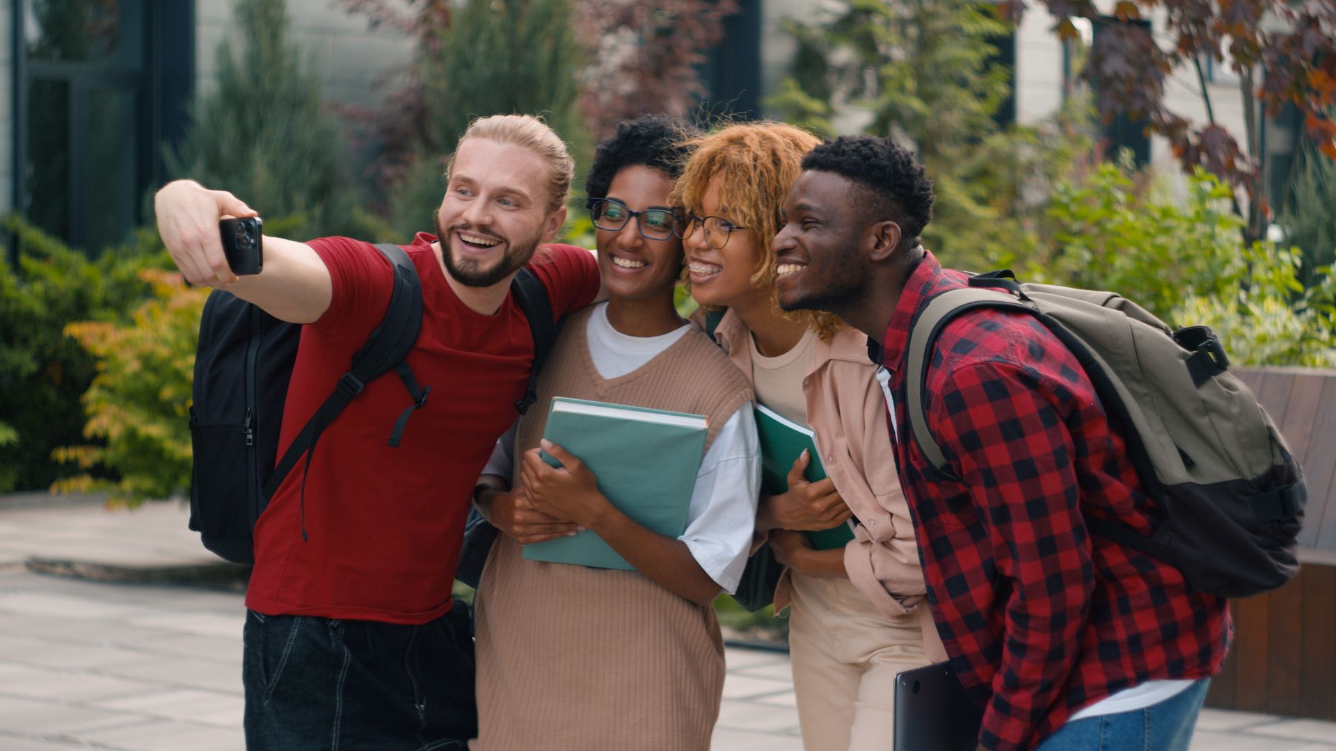 A group of young people are taking a selfie together.