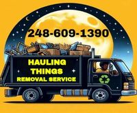 A hauling things removal service truck with a full moon in the background