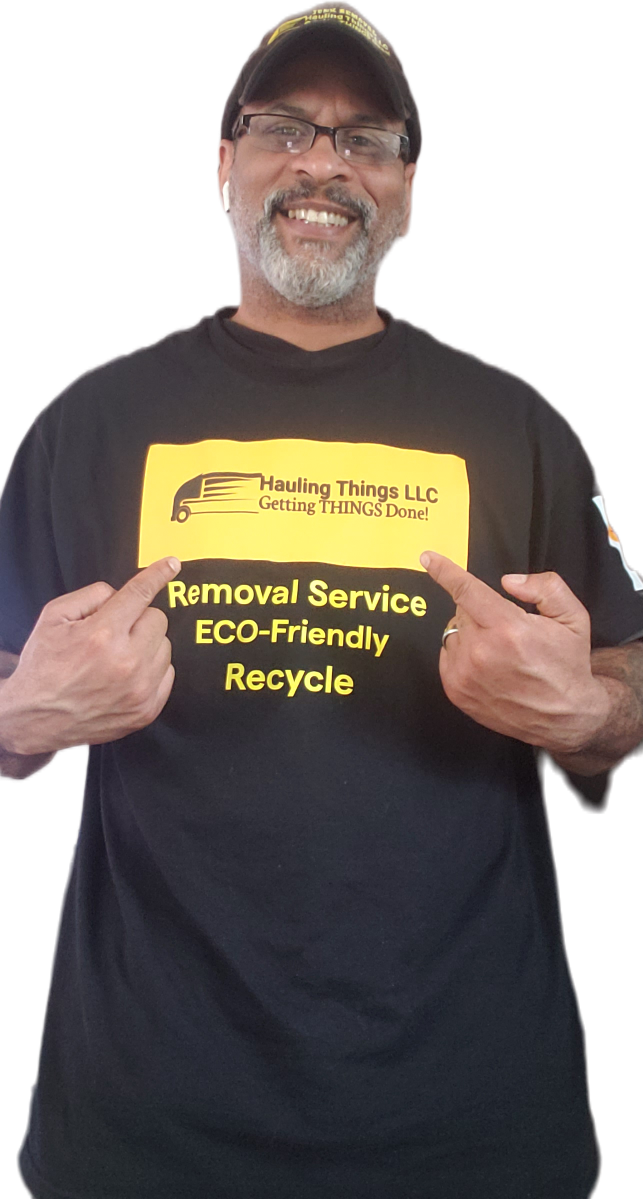 A man is wearing a black t-shirt that says removal service, eco-friendly recycling.