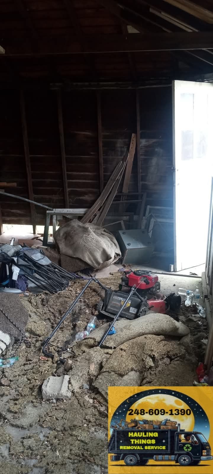 A pile of trash in a garage next to a truck.